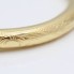 Brazalete rígido labrado de oro de segunda mano