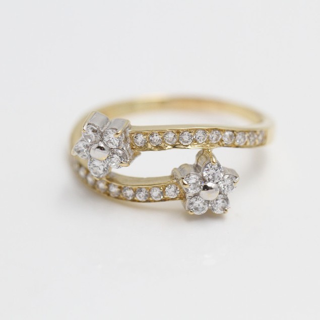 Anillo cruzado flores de oro con...