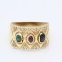 Anillo de oro con rubí, esmeralda, zafiro y circonitas