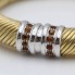 Brazalete flexible de oro con circonitas de segunda mano