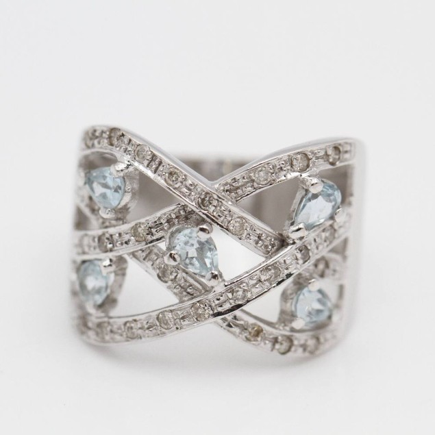 Anillo de oro con topacios y...