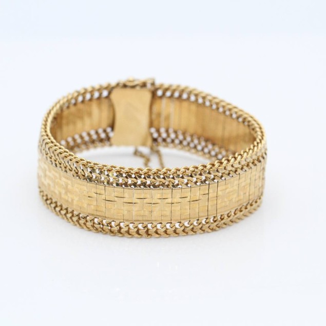 Pulsera articulada maciza de oro de...