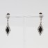 Boucles d'oreilles losange en or avec diamants et onyx d'occasion