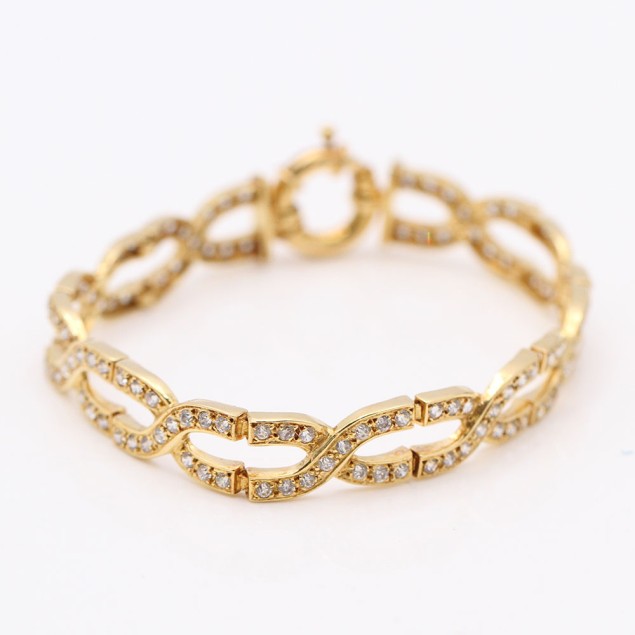 Bracelet tressé en or avec zircones...