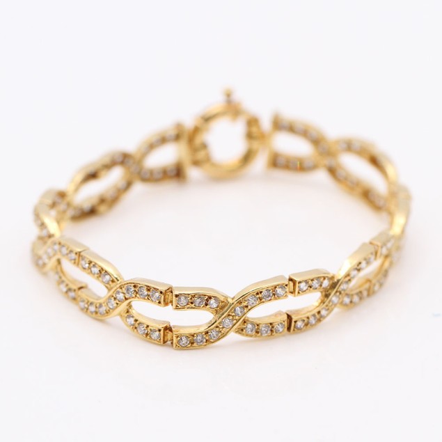 Pulsera trenzada de oro con...