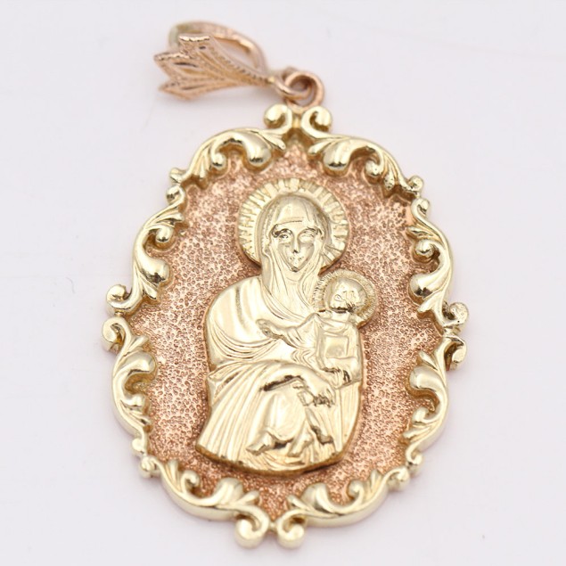 Pendentif vierge en or 14 carats...