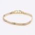 Pulsera calada con placa de oro bicolor de segunda mano