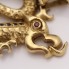 Colgante dragón de oro con zafiros y rubí de segunda mano