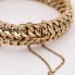 Pulsera barbada doble maciza de oro de segunda mano