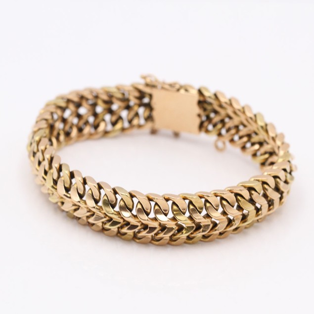 Pulsera barbada doble maciza de oro...