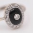 Anillo rosetón de oro con ónix y diamantes de segunda mano