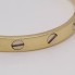 Brazalete remaches de oro de segunda mano