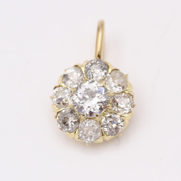 Colgante rosetón de oro con diamantes...