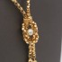 Collier d'occasion en perles et flocage d'or