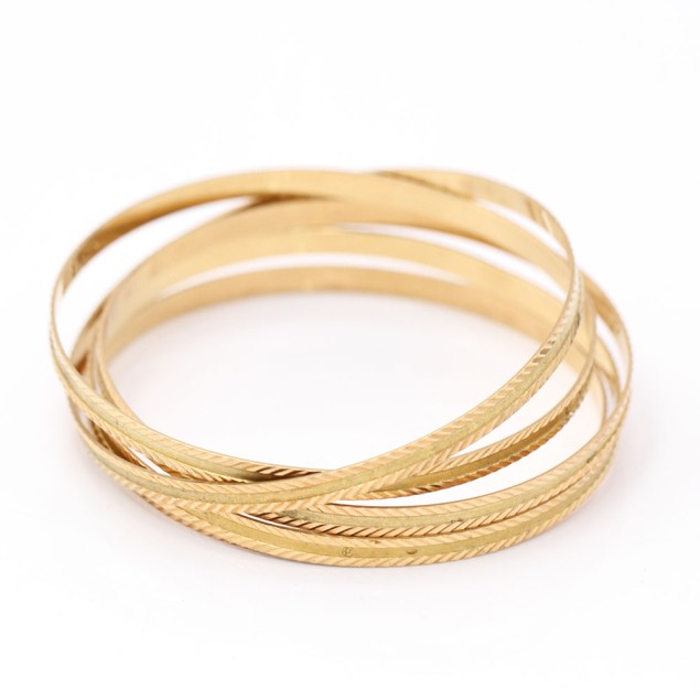 Conjunto 5 pulseras estriadas de oro...