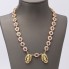 Collar rosetones con Cleopatras de oro 18k con circonitas