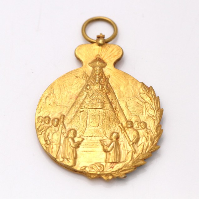 Medalla amb escut de la Casa Reial...