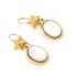 Boucles d'oreilles en nacre et en or jaune. Seconde main