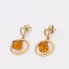 Boucles d'oreilles circulaires en or 18 carats avec citrine trotteuse
