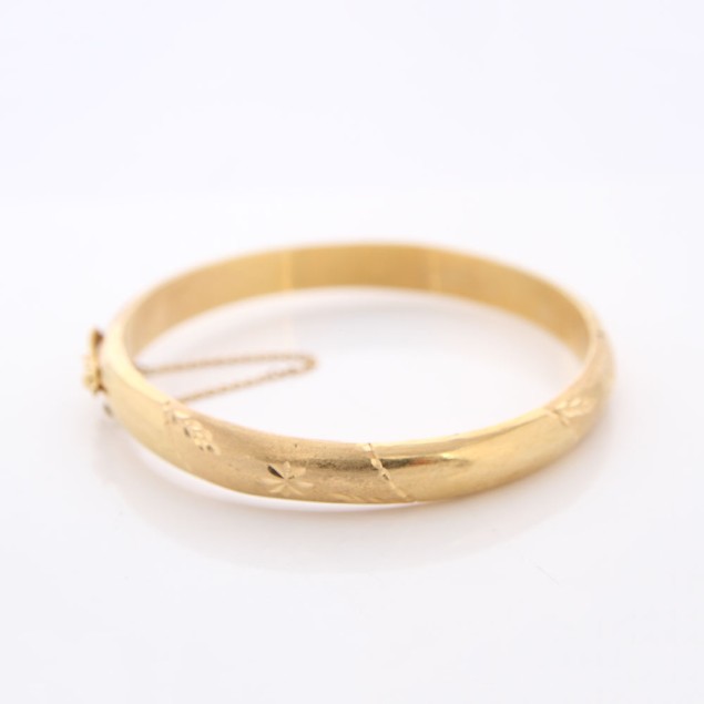 Brazalete labrado de oro 18k de...