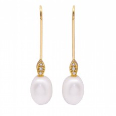 Boucles d\'oreilles avec perle ovale et diamants. Neuves