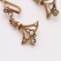 Boucles d'oreilles de style vintage en or 18k avec diamants
