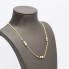 Collier d'occasion en or 18 carats avec cœurs et étoiles