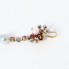 Pendentif en or 18k avec perles, rubis et diamants