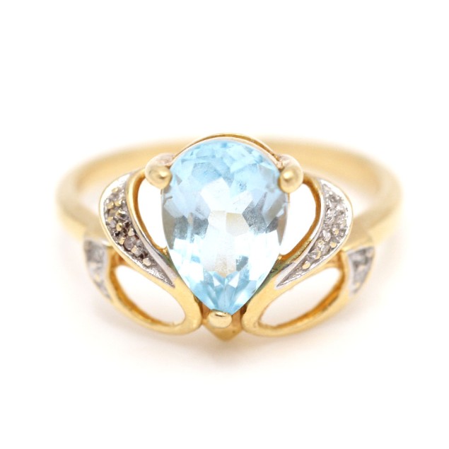 Bague en or 18k avec topaze bleue et...