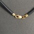 Collier en or 18 carats avec perle et caoutchouc