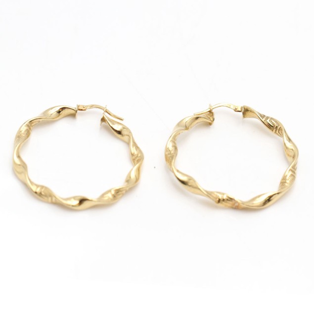 Créoles bouclées en or 18 k...