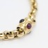 Bracelet jaseron en or 18k d'occasion avec rubis et saphirs
