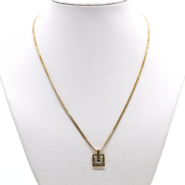 Collier d'occasion en or bicolore 18k...