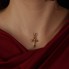 Pendentif CROIX en or jaune et pierres précieuses