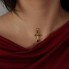 Pendentif CROIX en or jaune et pierres précieuses
