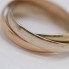 Alianza triple entrelazada de oro 18k de segunda mano