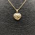 Cordon avec pendentif en forme de cœur en or 18 carats seconde main