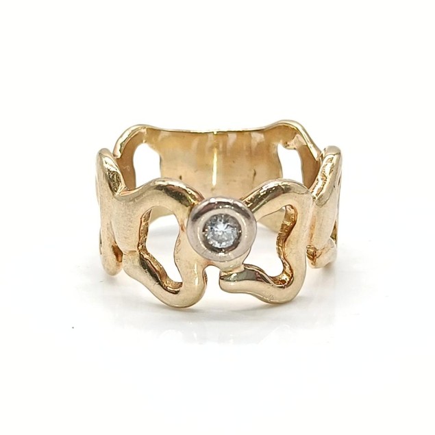 Solitario calado de oro 18k con...